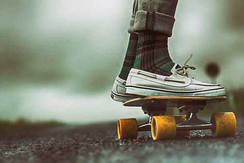 turkey person standing on skateboard during daytime wheels