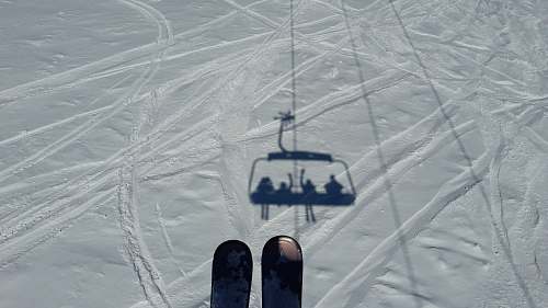 gudauri aerial photography of ski lift shadow on snow field during day georgia