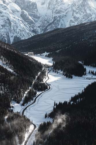 glacier birds eye view of road in between mountains ice