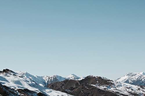 mountain photo of mountain covered by snow during daytime nature