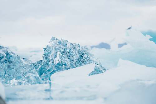 mountain shallow focus photography of snow-covered rocks glacier