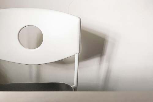 grey macro-shot of white chair wall