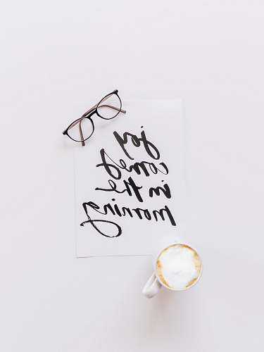 handwriting black-framed eyeglasses calligraphy