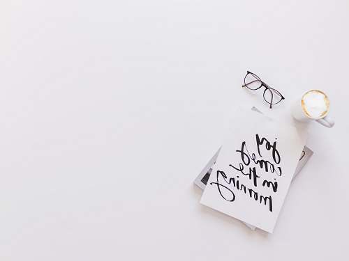 reading joy comes in the morning card beside coffee and eyeglasses white