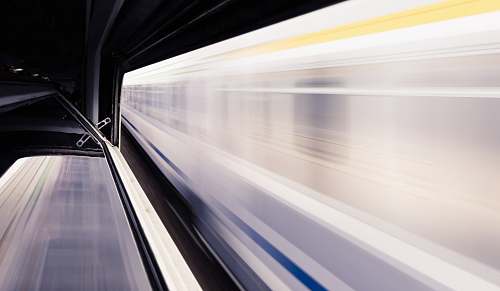 transportation timelapse photo of white train and subway station subway