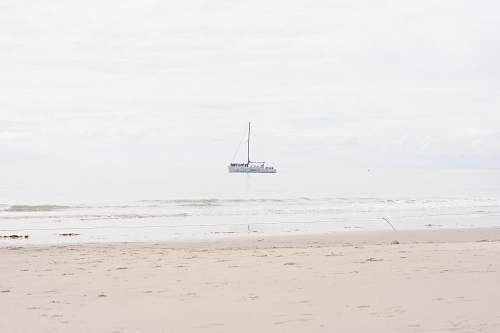 boat boat near shore during daytime vehicle