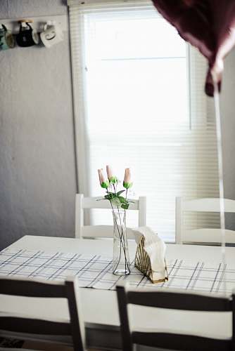 table clear glass vase with flowers on wooden dining table flower