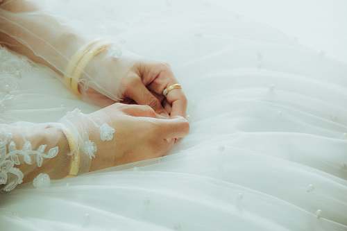 beautiful woman in white floral gown hands