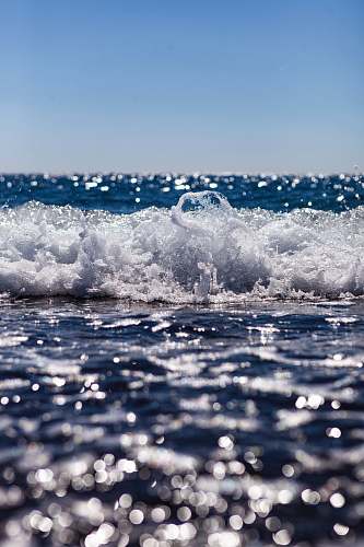 ocean close up photography of ocean wave at daytime wave