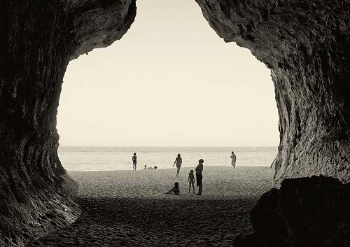 shoreline grayscale photography of people on seashore sea