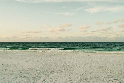 beach photography of calm beach side sea