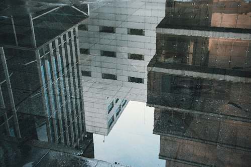 buildings reflection of buildings in water on floor reflection