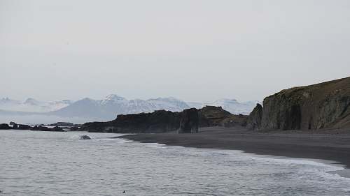 coast rock formation surrounded by boy of water ocean