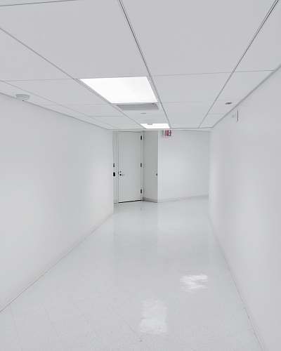 black-and-white empty hallway corridor