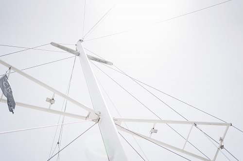 antenna low-angle photography of white metal tower electrical device