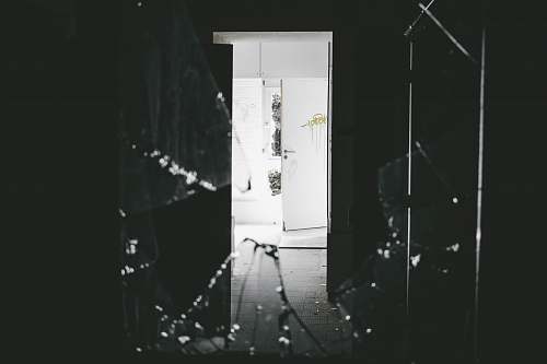 black-and-white opened white wooden door studio
