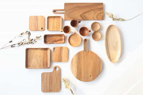 plywood top view of assorted shape and sized wooden kitchen utensils wood