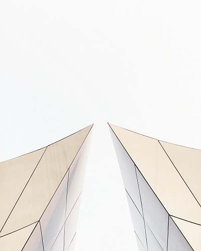 building two white buildings about to touch each other's peak architecture