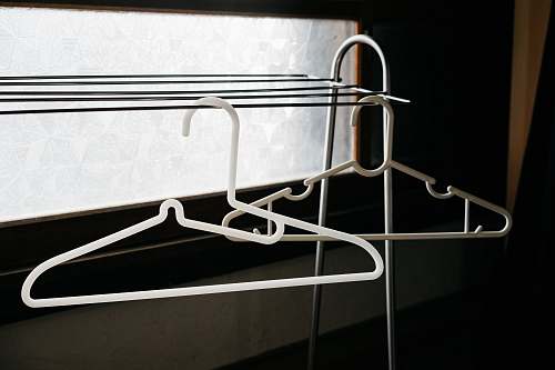 furniture two white clothes hangers chair