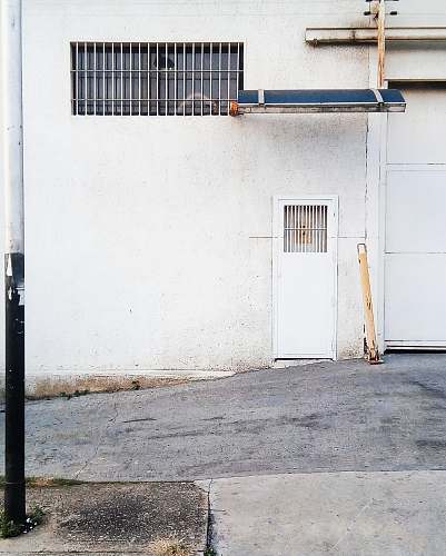 venezuela white metal closed door near road at daytime naguanagua