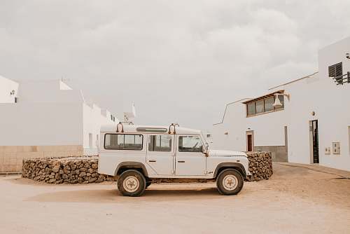 spain white SUV parked beside pile of woods graciosa