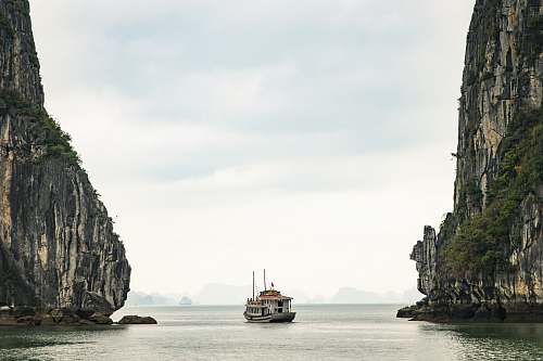 vietnam white watercraft on body of water boat
