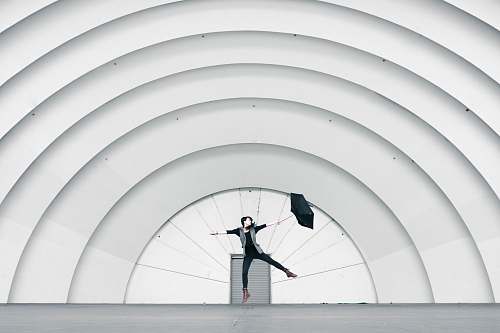 minimal woman standing on stage pattern