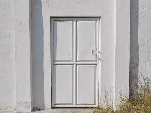 grey closed white door during daytime surabaya