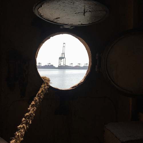 porthole gray metal tower hole