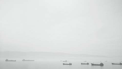 boats boat on body of water mist