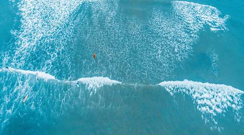 water aerial photography of barrel wave ocean