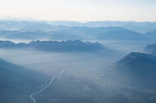 nature aerial photography of mountain and city buildings outdoors