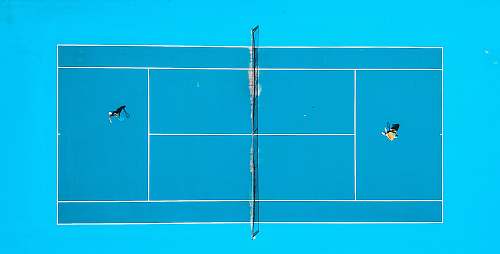 sport aerial photography of two person playing tennis drone view