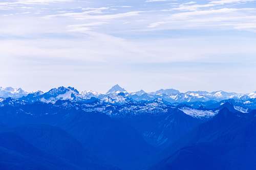 mountain aerial photography of white mountains during daytime snow