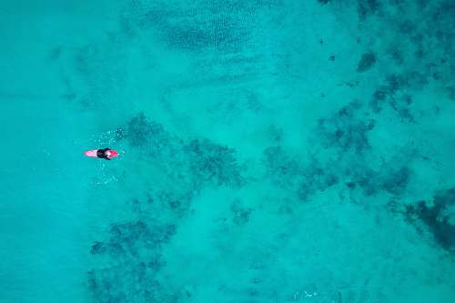 ramberg bird's eye view photography of person on body of water nordland