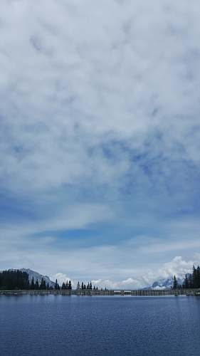 outdoors blue lake under white clouds nature