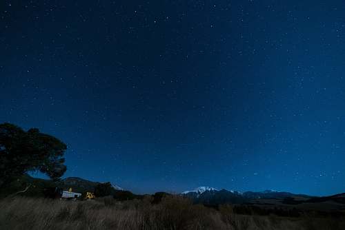 night blue starry skies camping