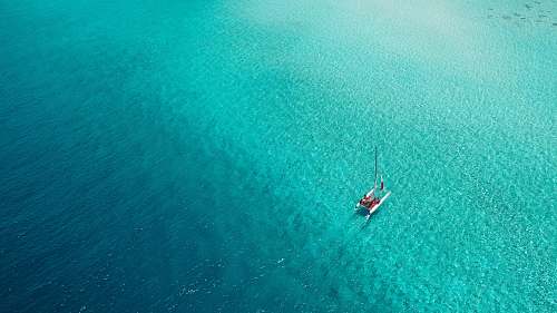 maldives boat on green water lagoon