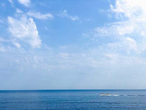 outdoors boat on sea under cloudy sky nature