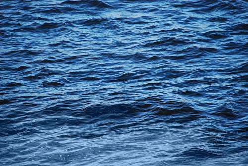 water body of water during daytime ripple