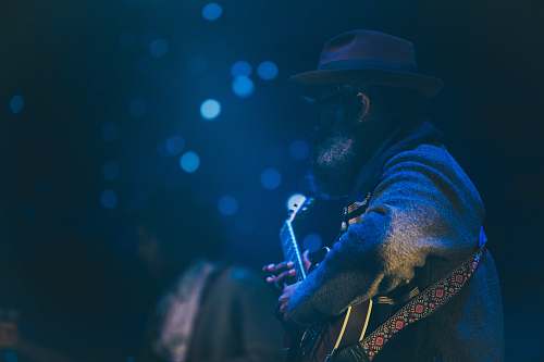 bokeh bokeh shot of man playing guitar music