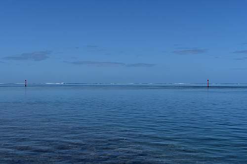 nature calm ocean under blue sky outdoors