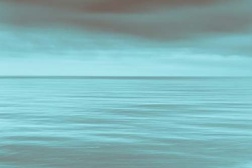 ocean calm sea under gray clouds sea