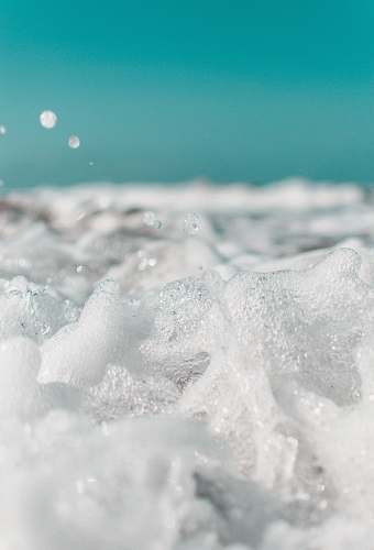 foam close-up photo of sea water nature