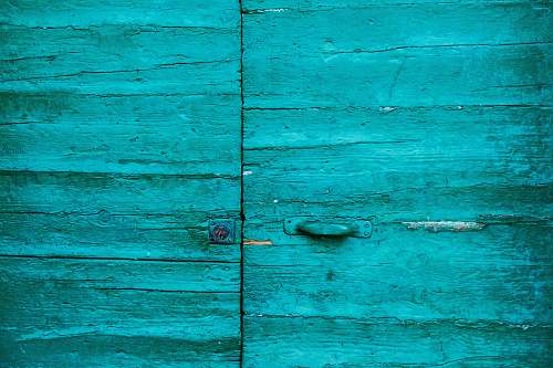riomaggiore closed teal wooden door italy