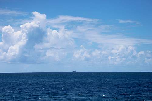 nature gray cruiser ship in the middle of ocean outdoors