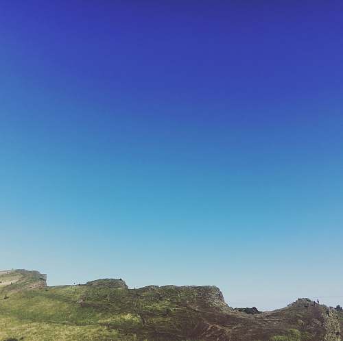 nature green and brown mountain under clear sky during daytime hill