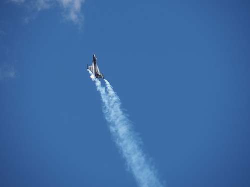smoke grey jet airplane during daytime aircraft