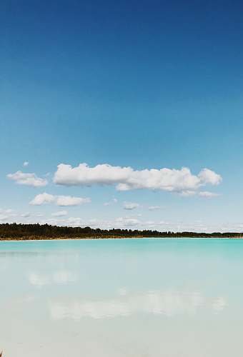cloud landscape photo of island under cloudy sky ocean