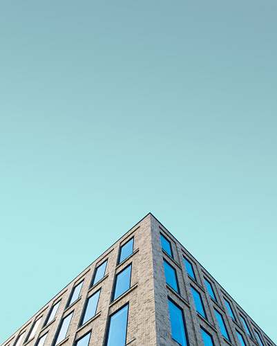 triangle low angle photography of brown building structrure slough